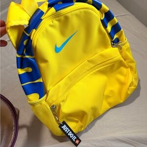 yellow nike mini backpack